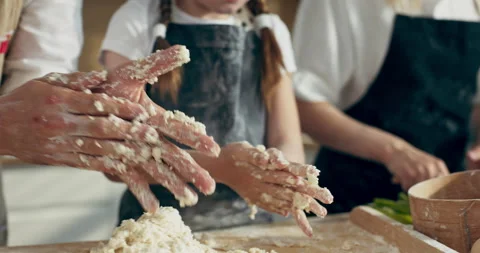 Close up shot on man's chhild's hands cleaning from homemade domestic dough on 库存影片 218632322