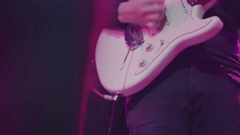 Close-up shot of a man's hand playing an electric guitar on stage. Stock Footage 145125580