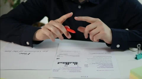Close-up shot of a mans hands in a formal shirt, gripping a pen while 스톡 동영상 315029874