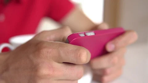 Close up shot of man's hands playing game on cellphone Stock Footage 85339837