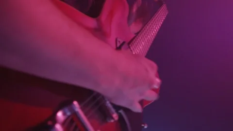 Close up shot of mans hands playing electric guitar Stock Footage 127128564