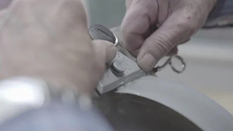 Close-Up Shot Of A Man's Hands Sharpening A Scissors. Stock Footage 264040682