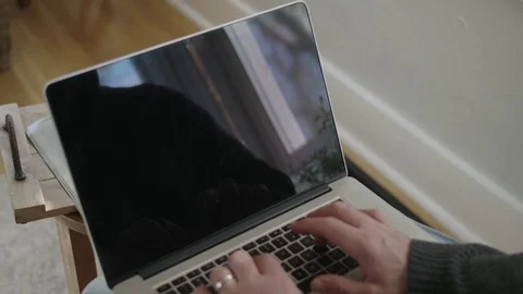Close up shot of man's hands typing on a laptop Stock Footage 70809525