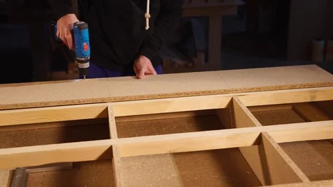 Close up shot of a man's hands, who works with a chipboard in a workshop Stock Footage 85242467