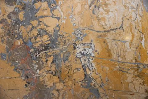 Close-up shot of a marble surface featuring a stunning combination of warm Stock Photos