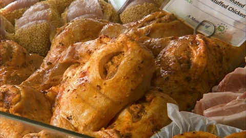 Close up shot of marinated and stuffed chicken Stock Footage 87391597