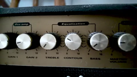 This is a close up shot of a Marshall amplifier featuring the knobs and Video stock 328345160