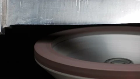Close-up shot of a master sharpening scissors on a diamond grinding cup Stock Footage 167514170