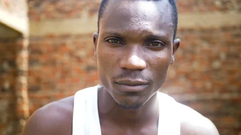 A close up shot of a mean looking young African gangster. Stock Footage 104627901
