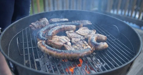 Close Up Shot of meat on Barbecue grill Stock Footage