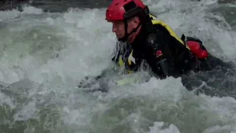 Close-Up Shot of Men Practicing Whitewater Rafting on Flat Raft Boards Stock Footage 130358621