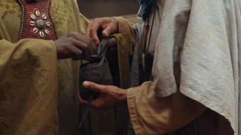 Close up shot of men trading materials and items in Timbuktu, Mali, Africa Stock Footage 202896675