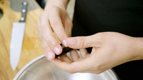 Close-up shot of men's hands preparing mussels at the cooking master class. 4K Stock Footage 91462543