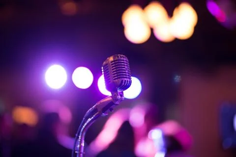 Close shot of a microphone with a blurred background Stock Photos