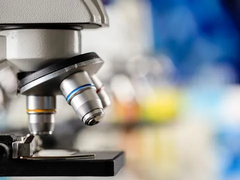 Close up shot of microscope lens and colorful blur background copy spae Stock Photos