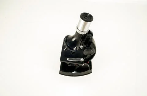 Close up shot of a microscope on a white surface Foto stock