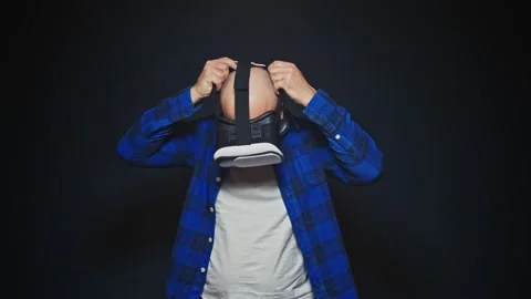 Close up shot of the middle age bearded man wearing virtual reality goggles and Stock Footage 148749285