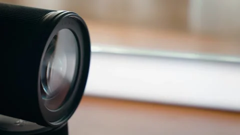 Close-up shot of a mirrorless camera lens on a desk. Stock Footage 237714485