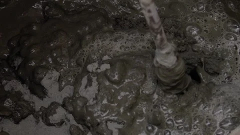 Close-up shot of mixing cement mortar for tiles. Stock Footage 246012685