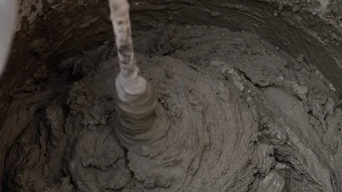 Close-up shot of mixing cement mortar for tiles. Stock Footage 246012696