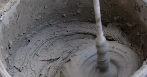 Close-up shot of mixing cement mortar for tiles..cement mortar. Stock Footage 246012885