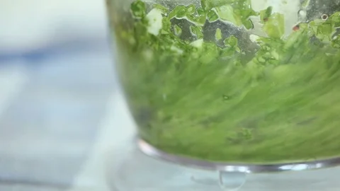 A close up shot of mixing spinach in blender. Stock Footage 90994523