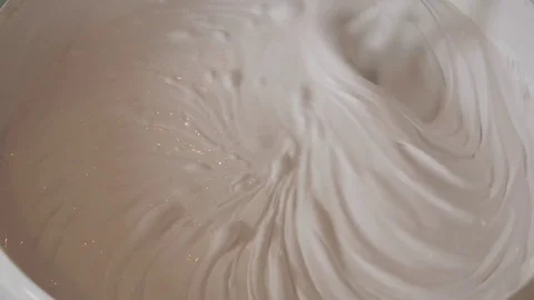 Close up shot of mixing white paint in bucket Stock-Footage 84885519