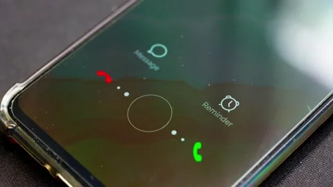 Close-up shot of a mobile phone receiving an incoming call, left unanswered. Stock Footage 334159949