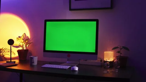Close up shot of modern chroma key green screen computer set up for work on desk Stock Footage 193977594