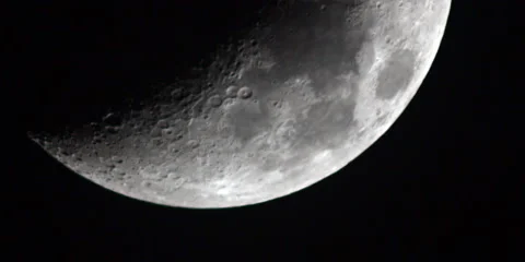 Close shot of the moon in a black sky. Stock Footage 46870424