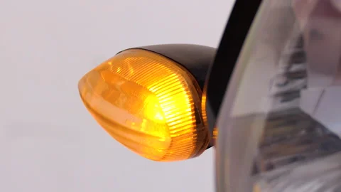 Close shot of a motorcycle blinking and indicating to take a turn Stock Footage 145361996