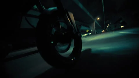 Close-up shot of motorcycles wheel while passing through the tunnel Stock Footage 264106244