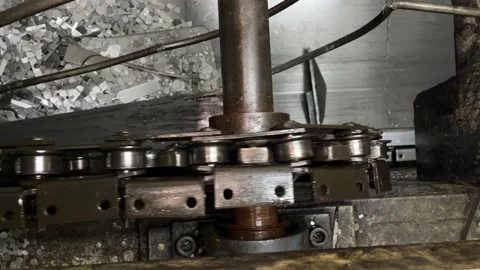 Close up shot of moving conveyor chain on factory Stock Footage 256858530
