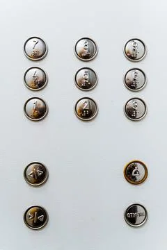 A close shot of the multi-function elevator button panel. On the button of th Stockfoto's