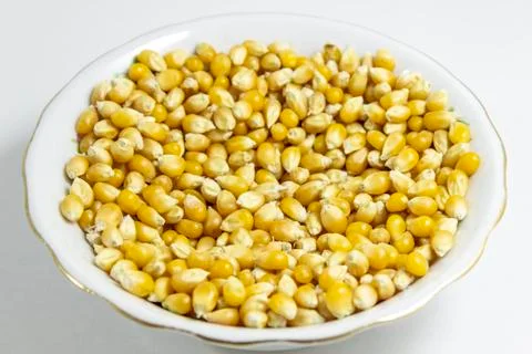 Close shot of multiple corn seeds in the white cup Foto stock