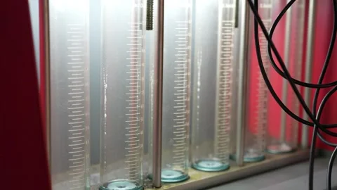 Close-up shot of multiple glass measurement tubes with scale markings Stock Footage 347300670
