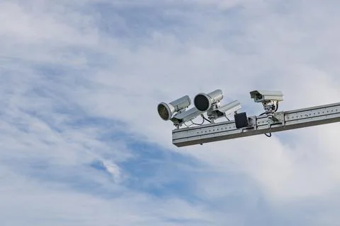 A close-up shot of multiple high-tech cameras and flash units mounted on a bo Foto stock