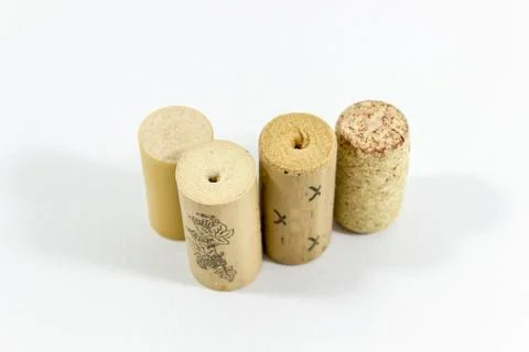Close-up shot of multiple wine corks with blurry white background Stock Photos