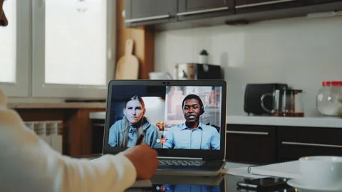 Close-up shot of Multiracial colleagues working home on quarantine by making Stock Footage 143457998