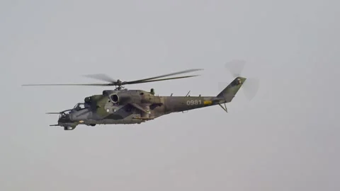 Close shot of NATO military attack helicopter Mil Mi-35 air force flying in the Stock Footage 337204052
