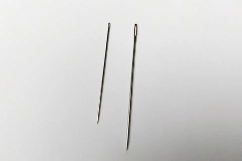 Close up shot of Needle on white background, needle for sewing, stitching n.. Foto stock