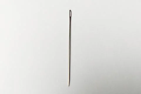 Close up shot of Needle on white background, needle for sewing, stitching n.. Foto stock