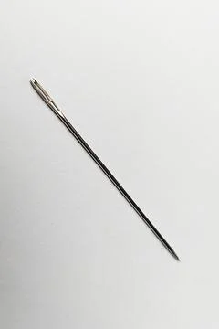 Close up shot of Needle on white background, needle for sewing, stitching n.. Foto stock
