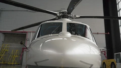 Close Shot of a New helicopter window Standing in a Aircraft Maintenance Hangar Stock Footage 219407839