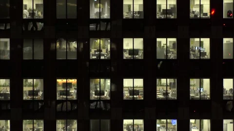 Close up shot of office building window at night. Stockbeeldmateriaal 337654235