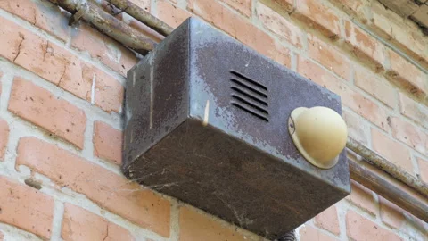 A close up shot of an old and rusty fire alarm Stock Footage 96302648