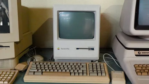 Close up shot of old apple Macintosh and Commodore discontinued computers Stock Footage 292788950