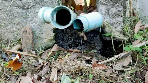 Close up shot of old blue PVC pipes leaking water Stock Footage 113291945