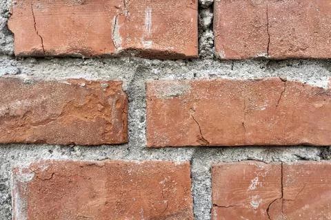 A close-up shot of the old bricks and mortar that make up the wall Stock Photos
