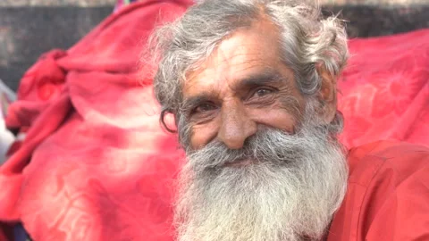 Close up shot of an old man with grey beard at Hanuman Mandir Stock Footage 164361731